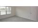 Bright bedroom with neutral walls and carpet at 11188 Hess Way, Oxford, FL 34484