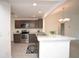 Modern kitchen with stainless steel appliances and breakfast bar at 11188 Hess Way, Oxford, FL 34484