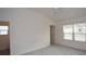 Spacious bedroom with high ceilings and carpet at 11188 Hess Way, Oxford, FL 34484