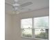 Bedroom with ceiling fan, window and blinds at 11188 Hess Way, Oxford, FL 34484