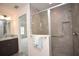 Modern bathroom with gray tiled shower at 11188 Hess Way, Oxford, FL 34484
