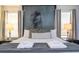 King-size bed with Darth Vader wall art and accent pillows at 4837 Dedication St, Kissimmee, FL 34746