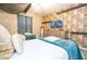 Two twin beds, a TV, and dresser in a themed bedroom with patterned walls at 4837 Dedication St, Kissimmee, FL 34746