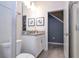 Bathroom with white vanity and gray tile floor at 4837 Dedication St, Kissimmee, FL 34746