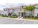 Three-story townhouses with parking and landscaping at 4837 Dedication St, Kissimmee, FL 34746