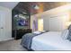 Bedroom with Star Wars themed wall art and large TV at 4837 Dedication St, Kissimmee, FL 34746
