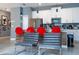 Modern kitchen with red barstools and stainless steel appliances at 4837 Dedication St, Kissimmee, FL 34746