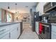Modern kitchen with island and stainless steel appliances at 4837 Dedication St, Kissimmee, FL 34746