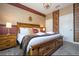 King bed, wooden headboard, and book-themed wall at 4837 Dedication St, Kissimmee, FL 34746