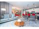 Spacious living area with a comfy couch and views into kitchen and dining area at 4837 Dedication St, Kissimmee, FL 34746