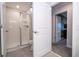 Bathroom with shower, toilet, and a door to another room at 4837 Dedication St, Kissimmee, FL 34746