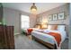 Well-lit bedroom with two twin beds and one king bed, offering ample space and comfort at 4837 Dedication St, Kissimmee, FL 34746