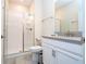 Clean bathroom with a shower and gray vanity at 4837 Dedication St, Kissimmee, FL 34746