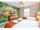 Jungle-themed bedroom with two twin beds and a king bed, featuring a large TV at 4837 Dedication St, Kissimmee, FL 34746
