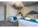 Two twin beds, a TV, and decorative wall coverings in a themed bedroom at 4837 Dedication St, Kissimmee, FL 34746