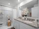 Double vanity bathroom with a shower and granite countertop at 2738 Flushing Dr, Apopka, FL 32703