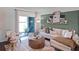Cozy living room featuring a sectional sofa and a large window at 2738 Flushing Dr, Apopka, FL 32703