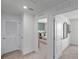 Bright hallway with doors to bedrooms and closets at 2738 Flushing Dr, Apopka, FL 32703