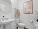 Clean powder room with pedestal sink and toilet at 2738 Flushing Dr, Apopka, FL 32703