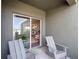 Relaxing patio with seating and view of the kitchen at 2738 Flushing Dr, Apopka, FL 32703