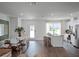 Open living area with hardwood floors, modern kitchen, and island at 2738 Flushing Dr, Apopka, FL 32703