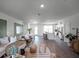 Spacious living room showcasing neutral tones, a comfy sectional sofa, and an open floor plan at 2738 Flushing Dr, Apopka, FL 32703