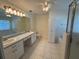 Clean bathroom with double vanity and separate tub and shower at 20505 Queen Alexandra Dr, Leesburg, FL 34748