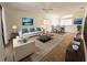 Spacious living room with light beige carpet and furniture at 20505 Queen Alexandra Dr, Leesburg, FL 34748