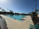 Outdoor swimming pool with deck and lounge chairs at 20505 Queen Alexandra Dr, Leesburg, FL 34748