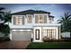 Two-story house with a modern design and a gray garage door at 6 W Hazel St, Orlando, FL 32804