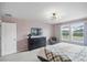 Bedroom with king bed, dresser, and window with backyard view at 936 Paradise Dr, Davenport, FL 33897