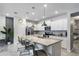 Modern kitchen with granite counters, stainless steel appliances, and island at 936 Paradise Dr, Davenport, FL 33897