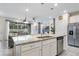 Modern kitchen with large island, granite countertops, and stainless steel appliances at 936 Paradise Dr, Davenport, FL 33897