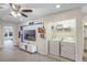 Convenient laundry room with washer, dryer, and shelving at 936 Paradise Dr, Davenport, FL 33897