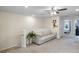 Loft area with sofa, ceiling fan, and access to bedrooms at 936 Paradise Dr, Davenport, FL 33897