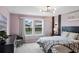 Spacious bedroom with large windows and plush bedding at 936 Paradise Dr, Davenport, FL 33897