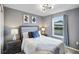 Cozy bedroom with a full-size bed and window view at 936 Paradise Dr, Davenport, FL 33897