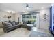 Spacious living area with sectional sofa and access to patio at 936 Paradise Dr, Davenport, FL 33897
