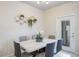 Dining room with marble table and gold hexagonal shelves at 936 Paradise Dr, Davenport, FL 33897