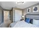 Bedroom with full-size bed, window, and adjacent bathroom at 936 Paradise Dr, Davenport, FL 33897