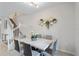 Bright dining area with marble table and gold geometric wall decor at 936 Paradise Dr, Davenport, FL 33897