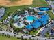 Aerial view of community with large resort-style pool and sports courts at 936 Paradise Dr, Davenport, FL 33897