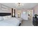 King-size bed, dresser, and access to en-suite bathroom at 936 Paradise Dr, Davenport, FL 33897