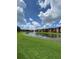 Stunning community lake view with lush green landscaping and water fountain at 5578 Metrowest Blvd # 107, Orlando, FL 32811