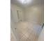 Bright bedroom with tile flooring and mirrored closet doors at 5578 Metrowest Blvd # 107, Orlando, FL 32811