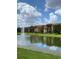 Apartment building reflected in a lake with fountain at 5578 Metrowest Blvd # 107, Orlando, FL 32811