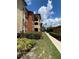 Exterior view of building with walkway and landscaping at 5578 Metrowest Blvd # 107, Orlando, FL 32811