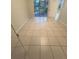 Bright bedroom with tile floors and sliding glass doors to patio at 5578 Metrowest Blvd # 107, Orlando, FL 32811