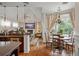 Bright dining area with a wooden table and chairs, adjacent to kitchen at 9011 Pinnacle Cir, Windermere, FL 34786