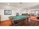 Game room features a pool table and comfortable seating at 9011 Pinnacle Cir, Windermere, FL 34786